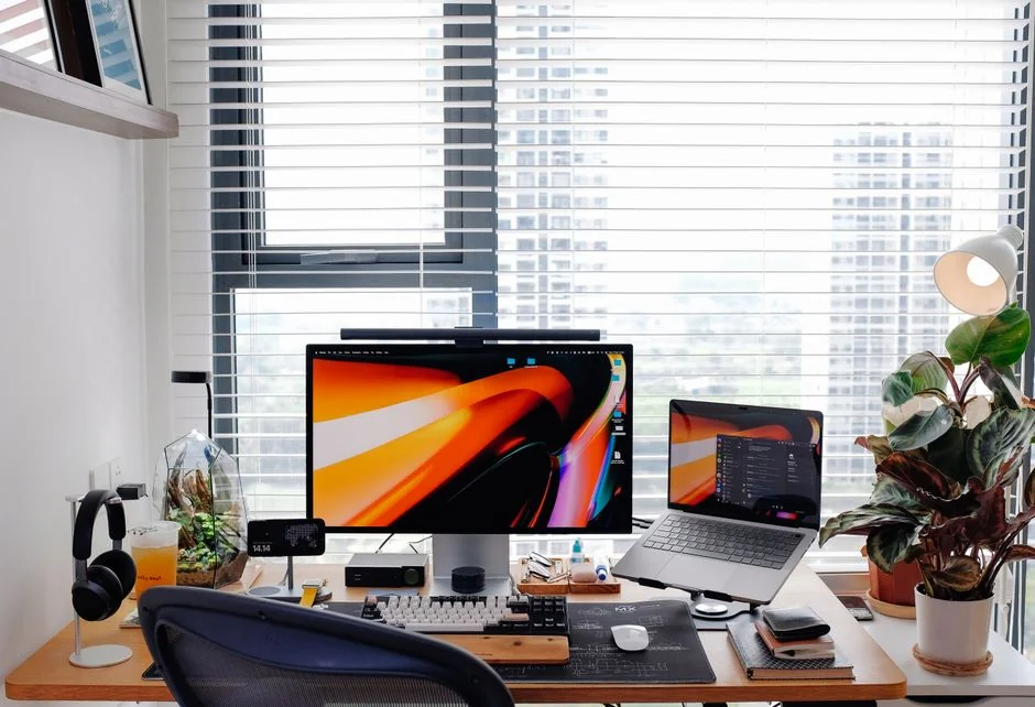 Mockup display on laptop and smartphone for design presentations in a modern workspace.